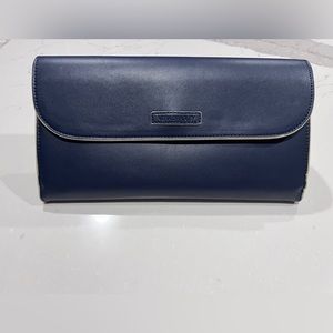 Brand new Vera Bradley faux leather clutch in navy blue